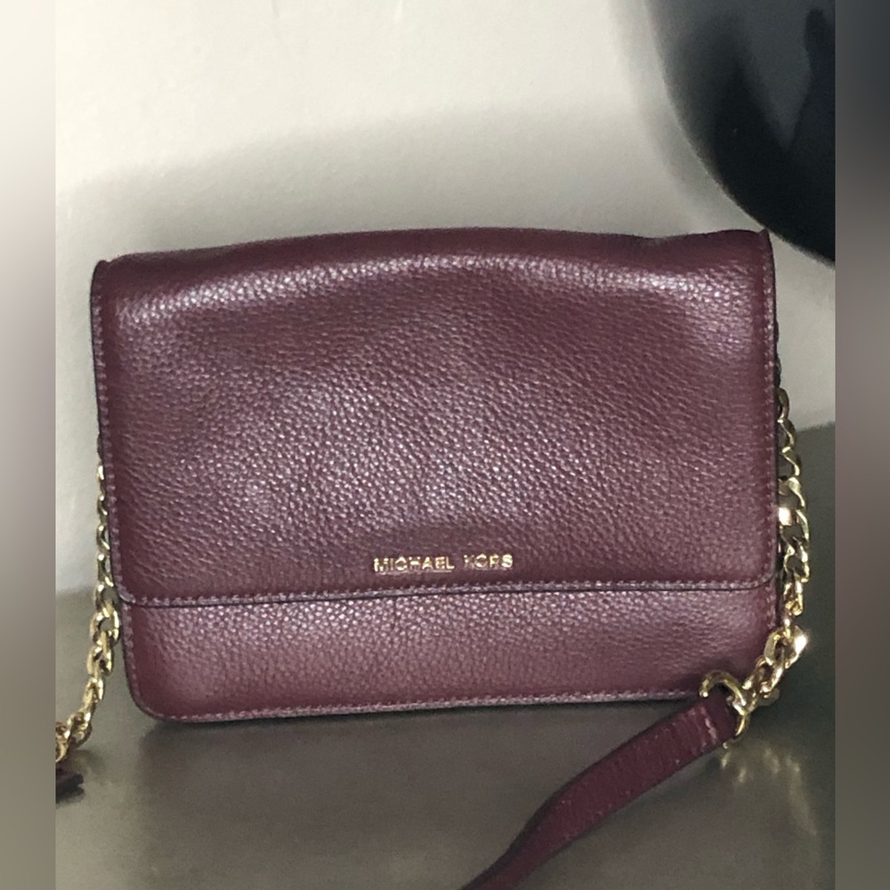 Michael Kors burgundy pebbled leather crossbody.